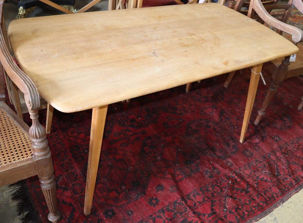 An Ercol rectangular elm dining table, W.134cm, D.70cm, H.70cm